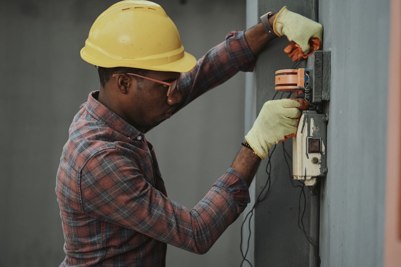 Electrician working in the field while customer calls can be handled remotely